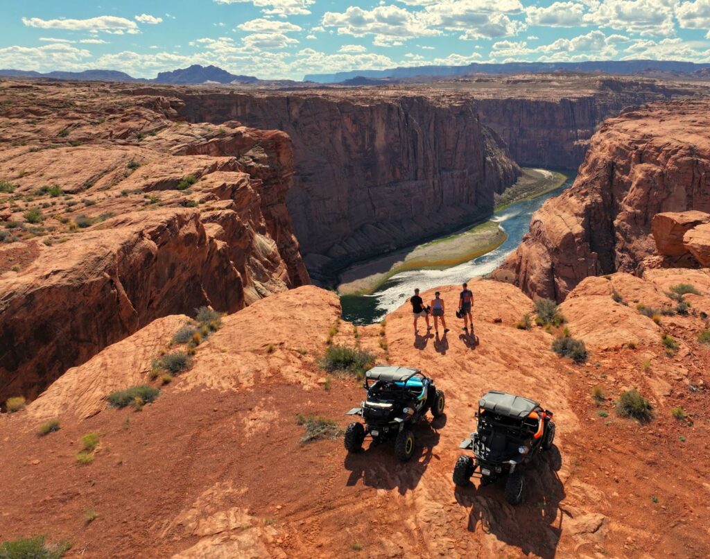 UTVs and people overlooking Horseshoe Bend